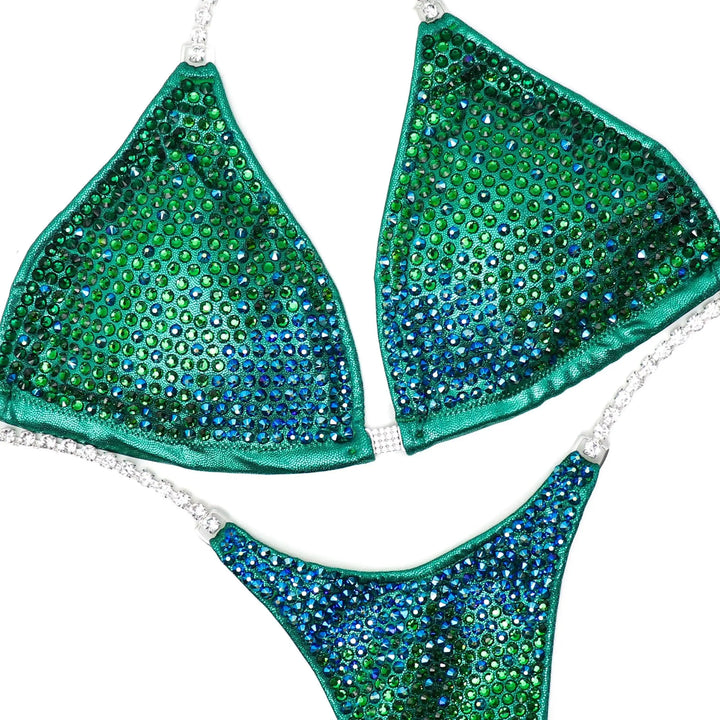 Green and blue gradient crystal bikini set with silver chain straps, designed for athletes highlighting physique.