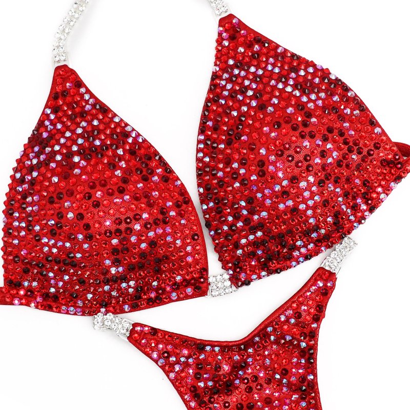 Elevate your stage presence with Angel Competition Bikinis' Hologram Red Competition Suits, including the stunning Hope's Flamin' Hot Multi Color design. Our bodybuilding bikinis are meticulously crafted for precision, featuring micro bikini competition suits for a sleek and dynamic look. The best bodybuilding suits!