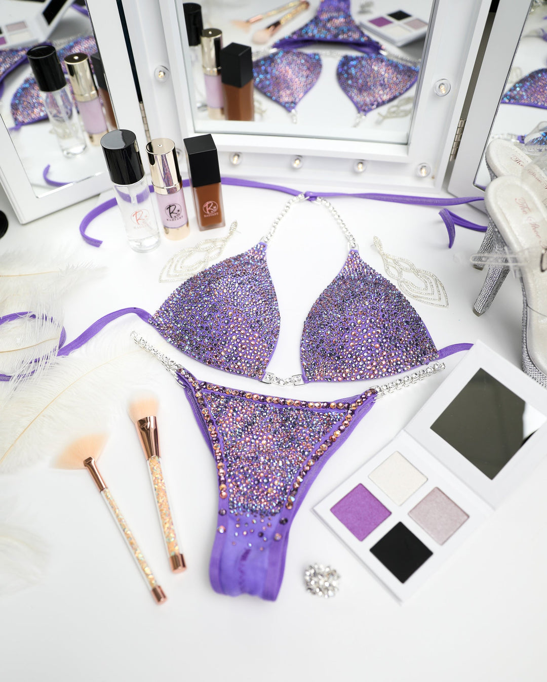 "Introducing Matte Lilac Radiance! 💜✨ Designed with Ndeye Ndour, this lilac bodybuilding suit features mesmerizing amethyst and purple crystals, ensuring you shine bright on stage. Elevate your performance and style with this stunning creation! #BodybuildingBeauty #MatteLilac #DesignerGallery"