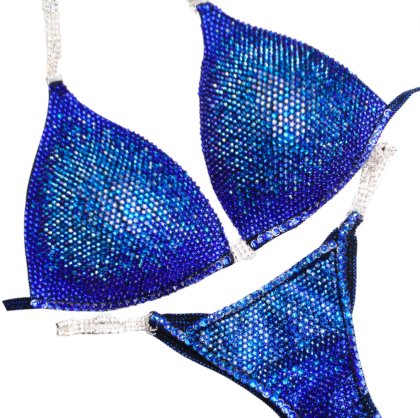 "Introducing Midnight Sapphire Nova! 💙✨ This mesmerizing blue bodybuilding suit features a stunning fade of blue crystals, from light to dark, ensuring you dazzle on stage. Elevate your presence with this show-stopping design! #BodybuildingElegance #MidnightSapphire #NovaDesigns"