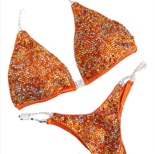 Introducing Orange Swirl Radiance 🧡! This vibrant orange competition suit for female bodybuilders features stunning yellow and rainbow AB crystals, making it uniquely eye-catching ✨. Shine bright on stage with this standout attire! #Bodybuilding #CompetitionSuit #OrangeSwirlRadiance 🌈👙🌟