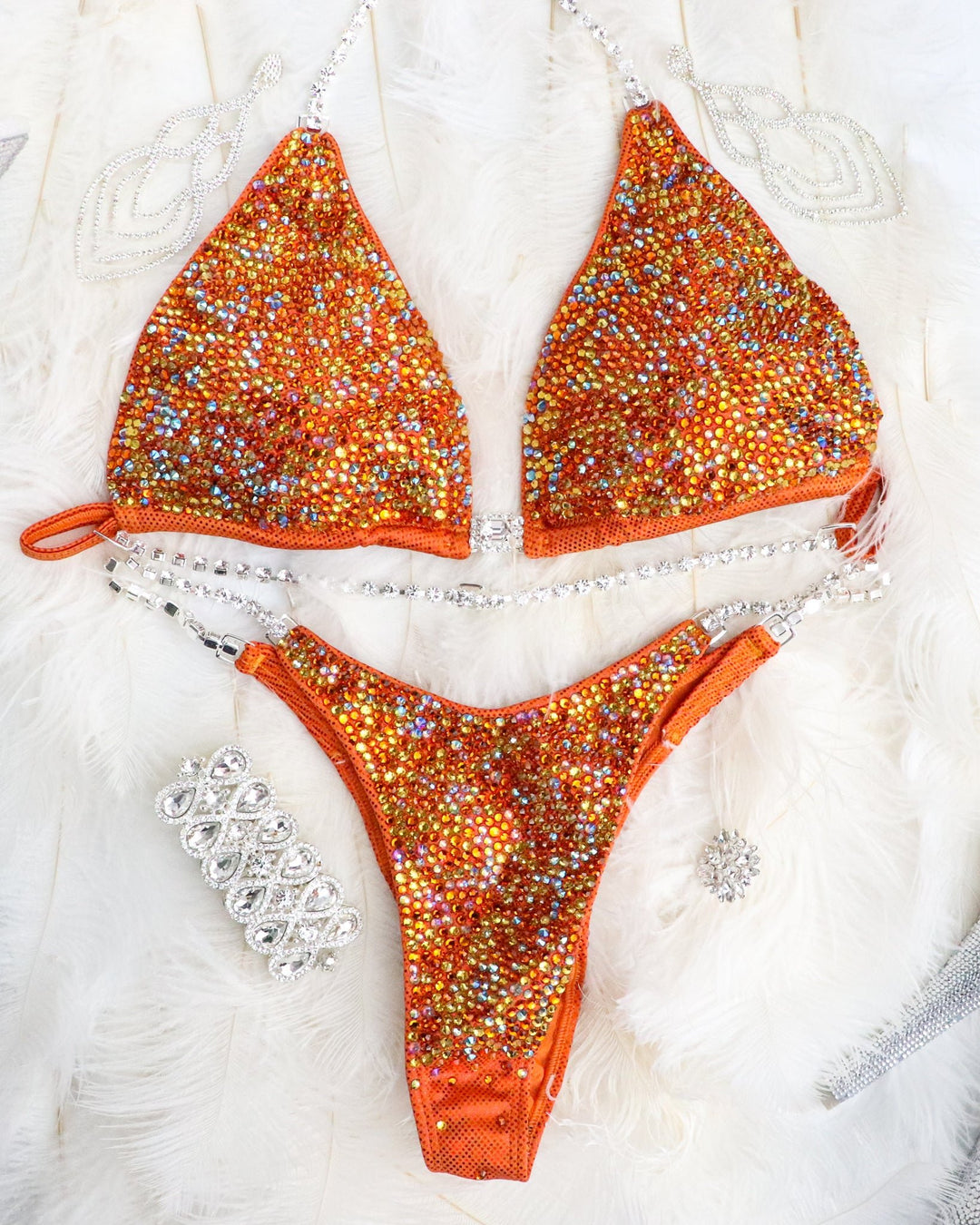 Introducing Orange Swirl Radiance 🧡! This vibrant orange competition suit for female bodybuilders features stunning yellow and rainbow AB crystals, making it uniquely eye-catching ✨. Shine bright on stage with this standout attire! #Bodybuilding #CompetitionSuit #OrangeSwirlRadiance 🌈👙🌟