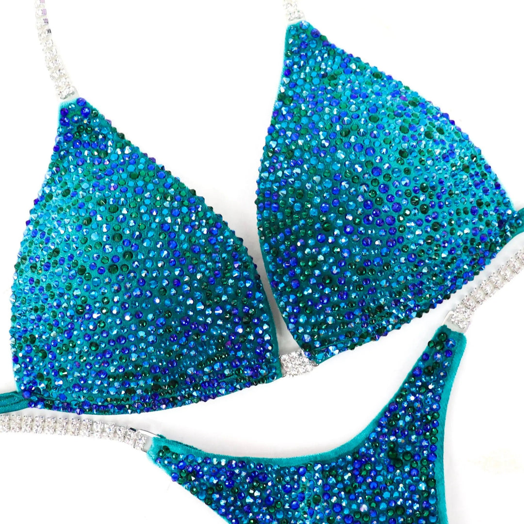 Peacock Velvet Radiance: A stunning velvet teal suit with green and blue crystals, designed to turn heads on stage! 💚💙✨
