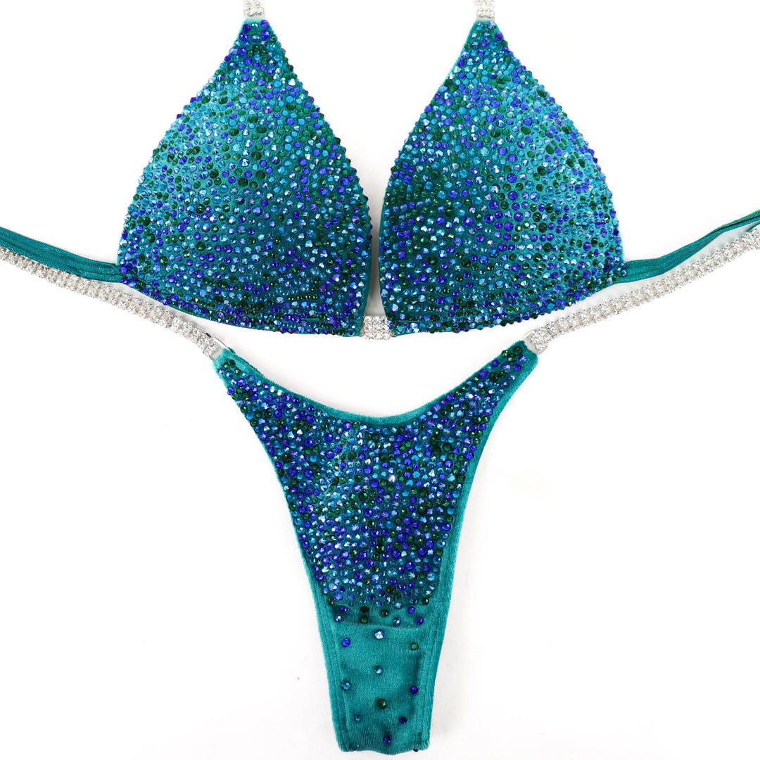 Peacock Velvet Radiance: A stunning velvet teal suit with green and blue crystals, designed to turn heads on stage! 💚💙✨