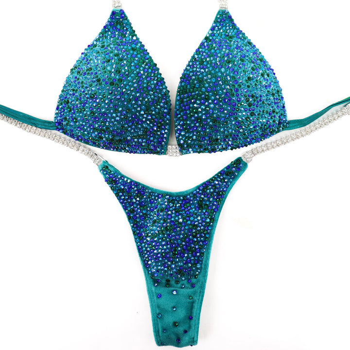 Peacock Velvet Radiance: A stunning velvet teal suit with green and blue crystals, designed to turn heads on stage! 💚💙✨