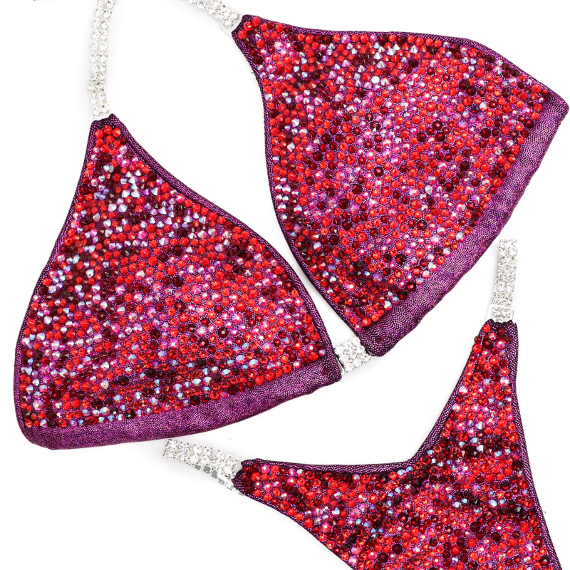 Introducing Ashley Kaltwasser's Cranberry Sauce Radiance! Designed for NPC Bikini or Wellness competitors, this suit features hologram cranberry, ensuring you stand out on stage with its vibrant red tones. Elevate your performance and presence with this captivating design.