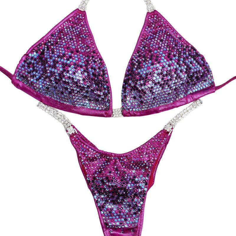 Introducing Purple Mulberry Gradient 💜! This exquisite mulberry competition suit showcases a stunning gradient of purple and pink crystals, making it truly unique and eye-catching. Stand out on stage with elegance and flair! #Bodybuilding #CompetitionSuit #PurpleMulberryGradient 👙💎🌟