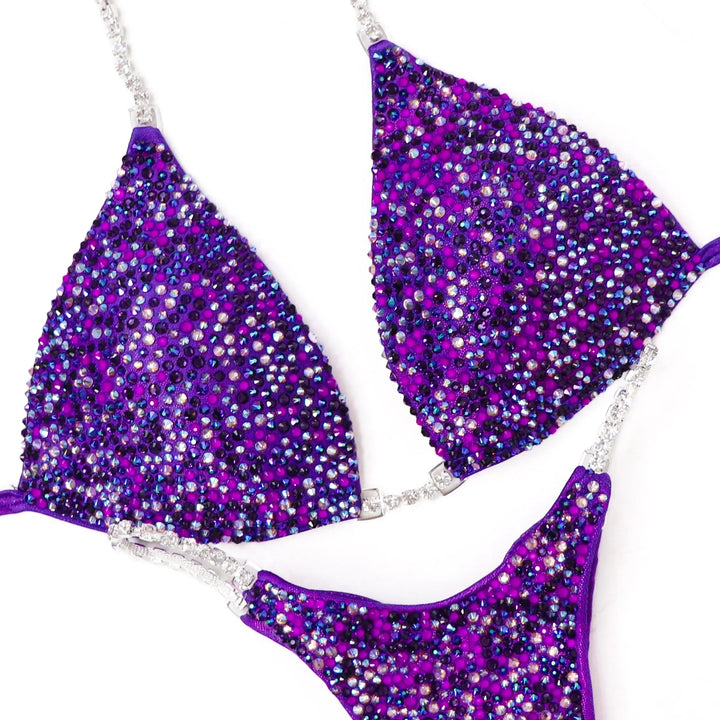 Unleash your power in the Purple Neon Pulse Radiance suit! A fierce purple design with purple & neon purple crystals for ultimate shine. 💜✨