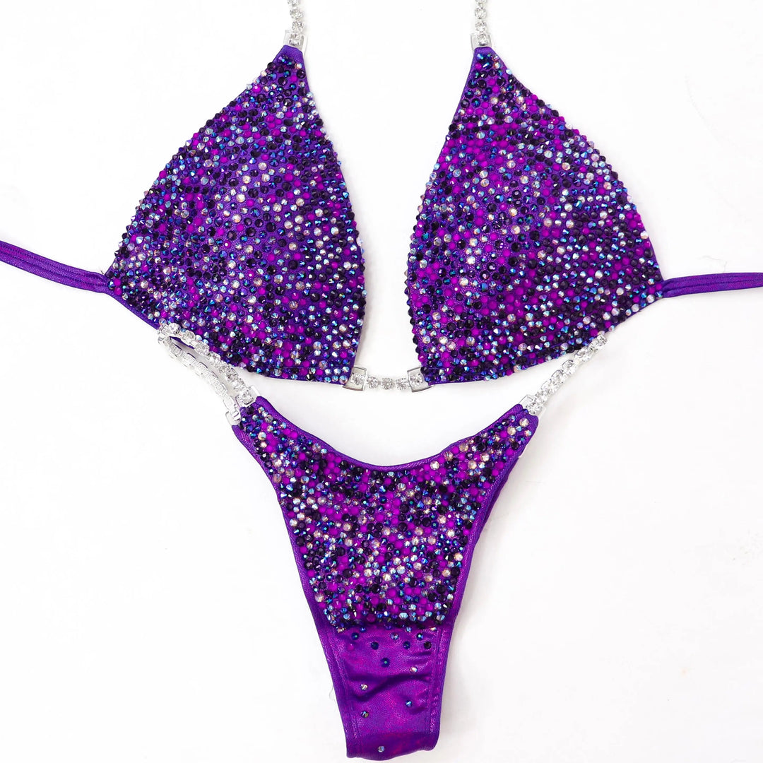 Unleash your power in the Purple Neon Pulse Radiance suit! A fierce purple design with purple & neon purple crystals for ultimate shine. 💜✨