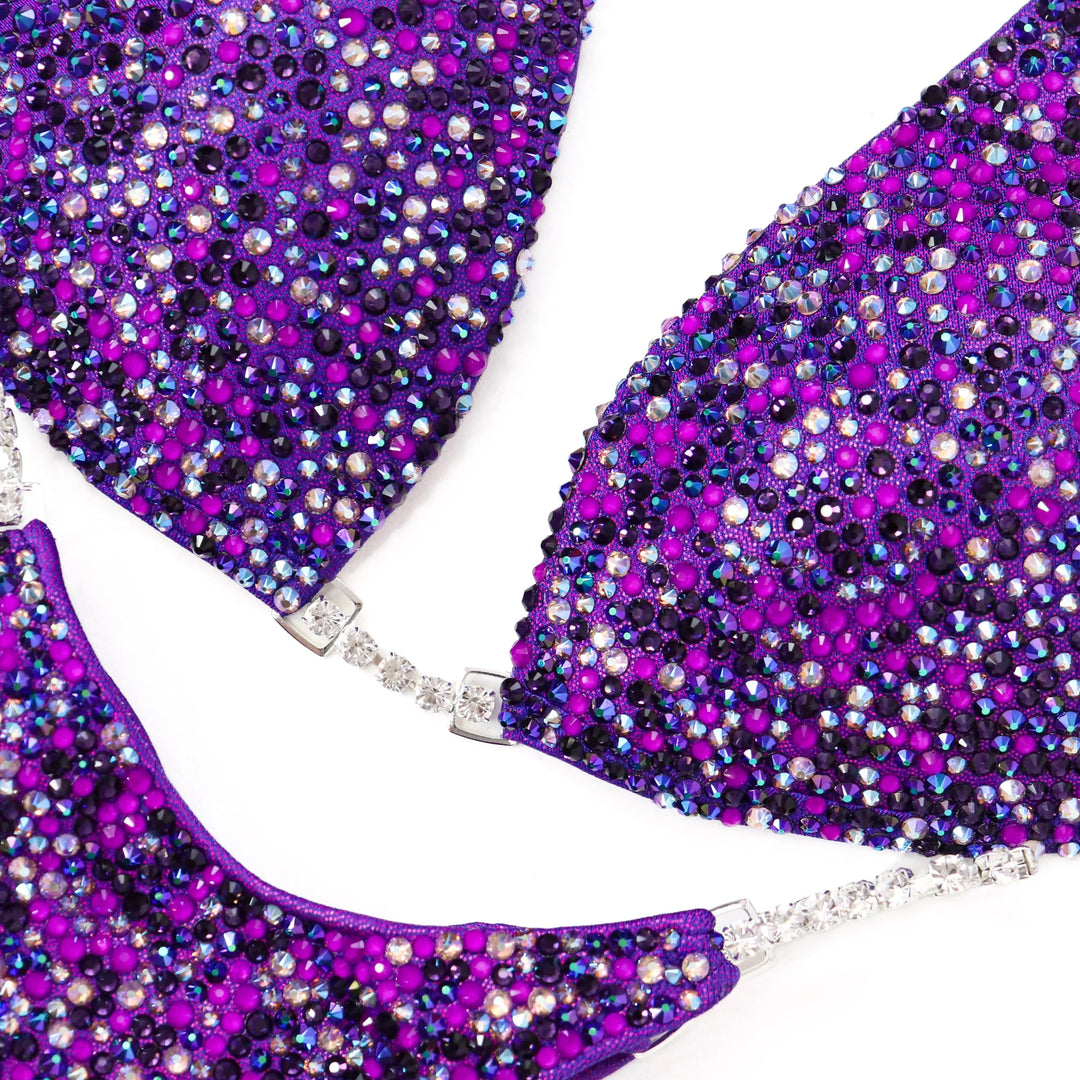 Unleash your power in the Purple Neon Pulse Radiance suit! A fierce purple design with purple & neon purple crystals for ultimate shine. 💜✨