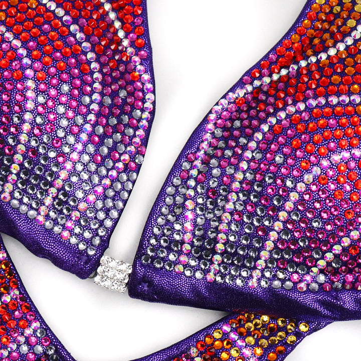 Introducing Purple Rainbow Crystal Flare 🌈! This newly added design boasts crystal AB, purple, fuchsia, red, tangerine, and sunflower crystals, ensuring a one-of-a-kind suit that radiates elegance and uniqueness on stage. #Bodybuilding #CompetitionSuit #CrystalFlare 💜👗🌟