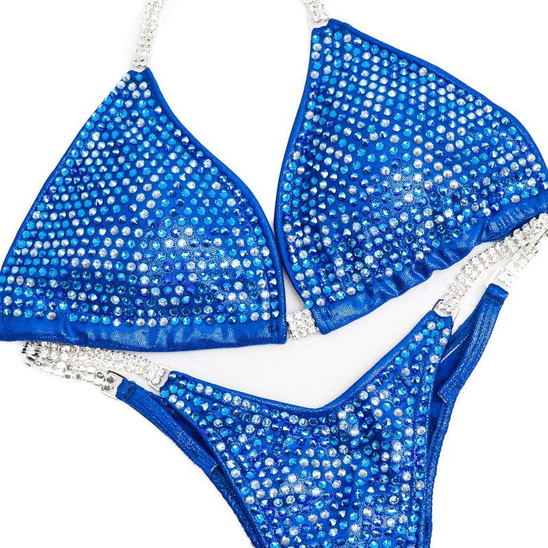 Savannah Watchman's inspired Capri Blue Pro competition suit, designed for NPC Bikini or Wellness competitors. Channel Savannah's confidence and dominance on stage with this exceptional suit. Stand out and own the spotlight with its captivating design!