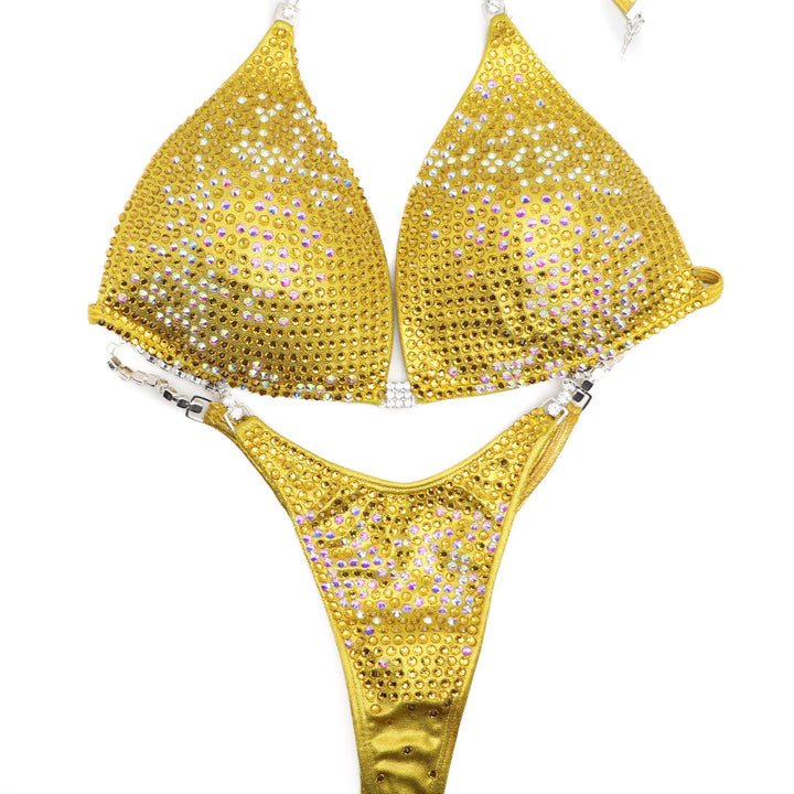 Introducing the Sunflower Trinity competition suit 🌻✨ Embrace the brilliance of yellow with a captivating gradient design from Sunflower crystals to Crystal AB and back to Sunflower. Perfect for female bodybuilders who aim to shine on stage with elegance and vibrancy! #Bodybuilding #CompetitionSuit #FitnessFashion