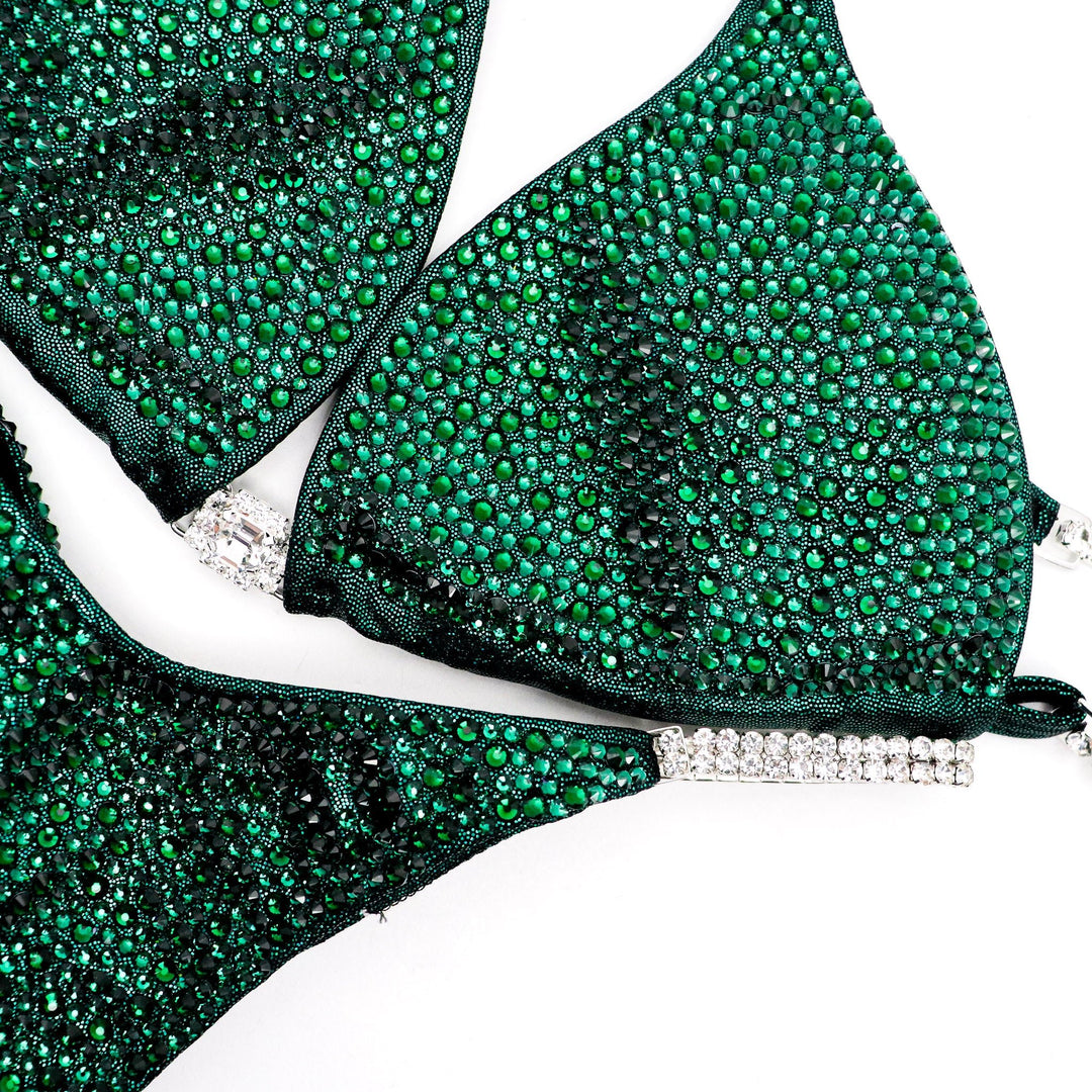 Unveil the True Emerald Radiance: a flawless emerald green competition suit adorned with shimmering Emerald crystals, designed to captivate on stage. Elevate your performance with this stunning piece! 💚💎✨ #Bodybuilding #CompetitionSuit #TrueEmeraldRadiance #EmeraldCrystals