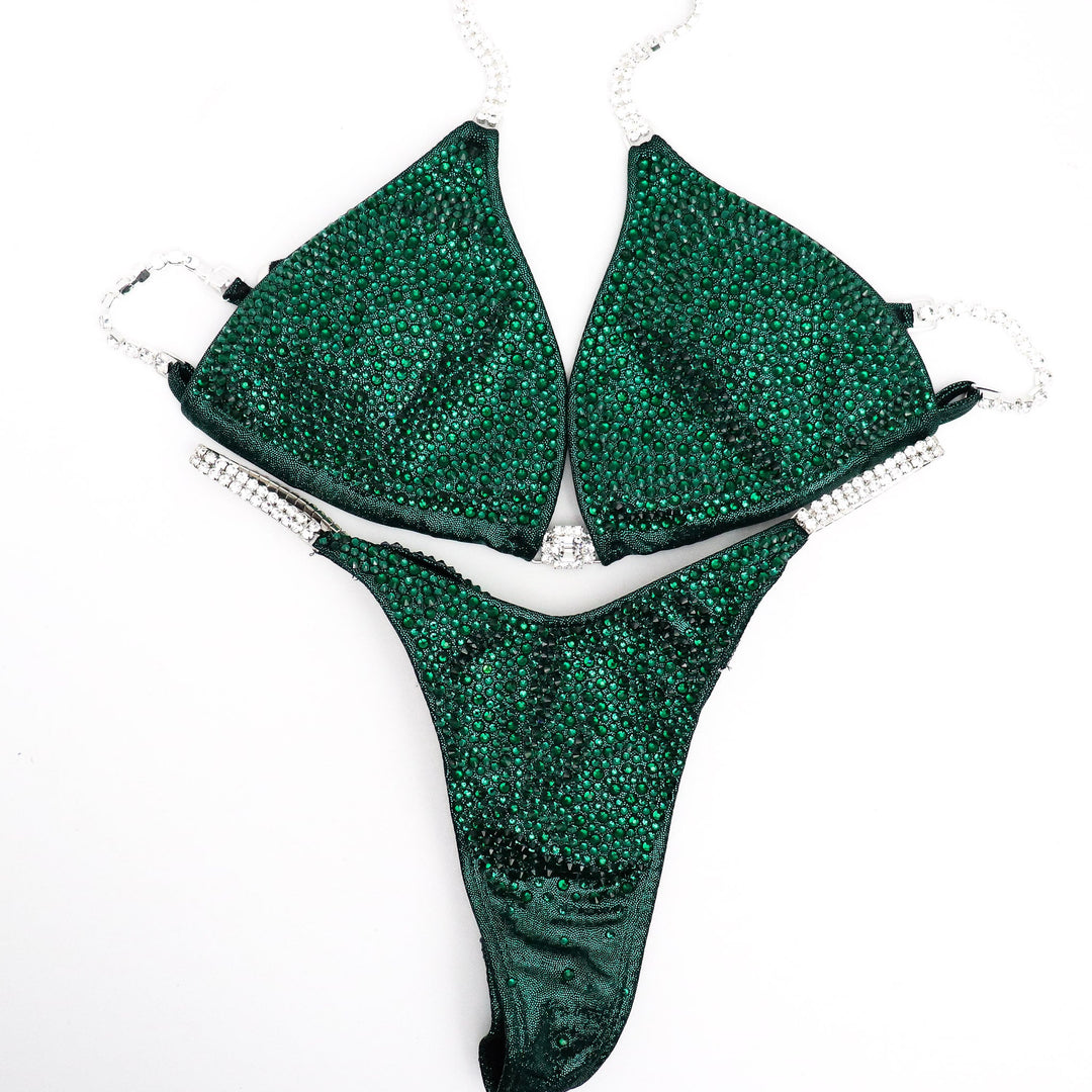 Unveil the True Emerald Radiance: a flawless emerald green competition suit adorned with shimmering Emerald crystals, designed to captivate on stage. Elevate your performance with this stunning piece! 💚💎✨ #Bodybuilding #CompetitionSuit #TrueEmeraldRadiance #EmeraldCrystals