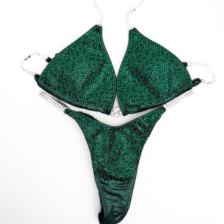 Unveil the True Emerald Radiance: a flawless emerald green competition suit adorned with shimmering Emerald crystals, designed to captivate on stage. Elevate your performance with this stunning piece! 💚💎✨ #Bodybuilding #CompetitionSuit #TrueEmeraldRadiance #EmeraldCrystals