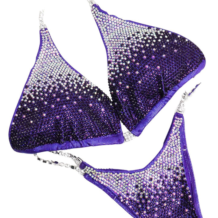 Introducing Violet Gradient: an Eggplant competition suit featuring Crystal AB fading into Violet, radiating with stunning shine! 💜✨ Perfect for female bodybuilders who want to dazzle on stage with elegance and style. Stand out confidently! #BodybuildingSuit #CompetitionReady #VioletGradient