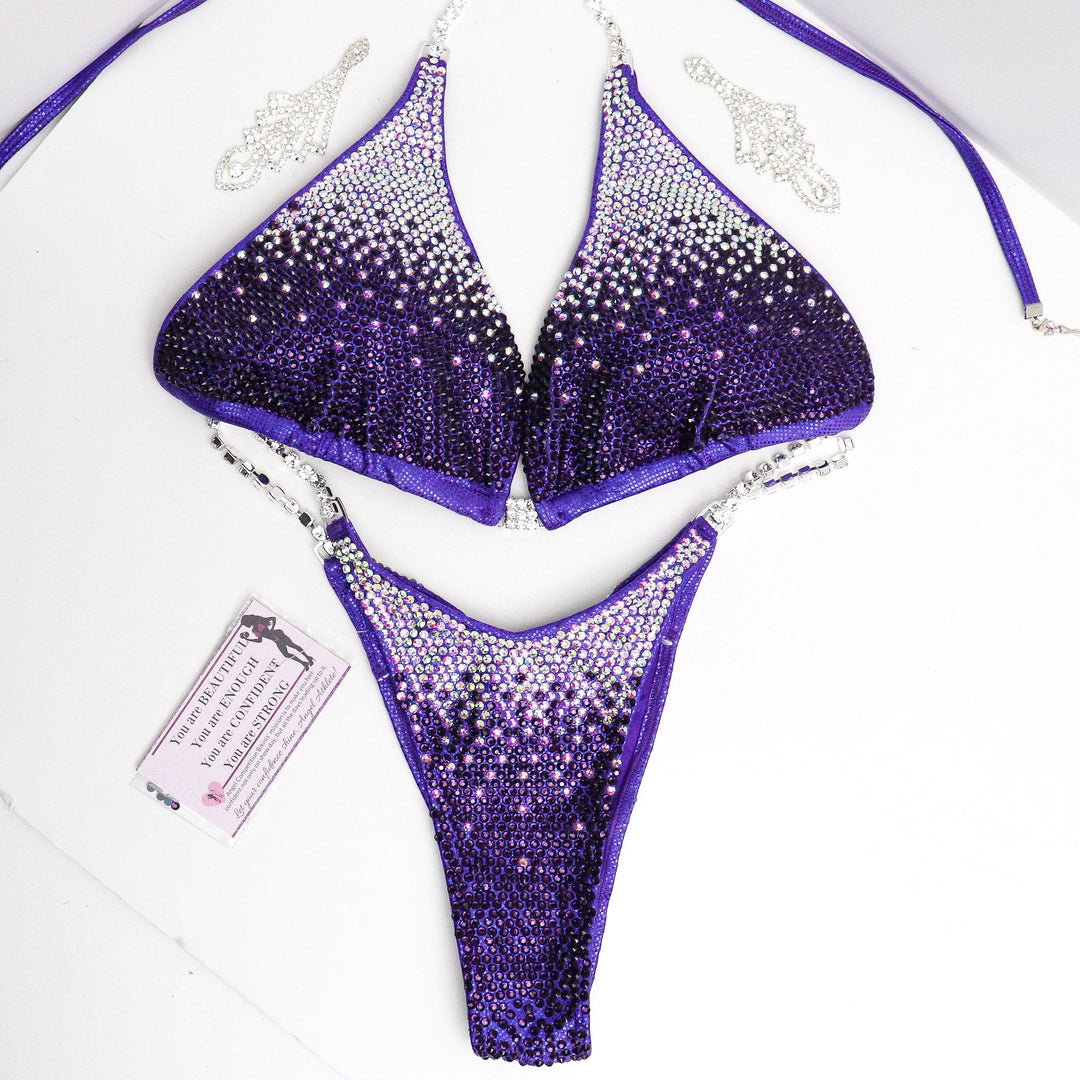 Introducing Violet Gradient: an Eggplant competition suit featuring Crystal AB fading into Violet, radiating with stunning shine! 💜✨ Perfect for female bodybuilders who want to dazzle on stage with elegance and style. Stand out confidently! #BodybuildingSuit #CompetitionReady #VioletGradient