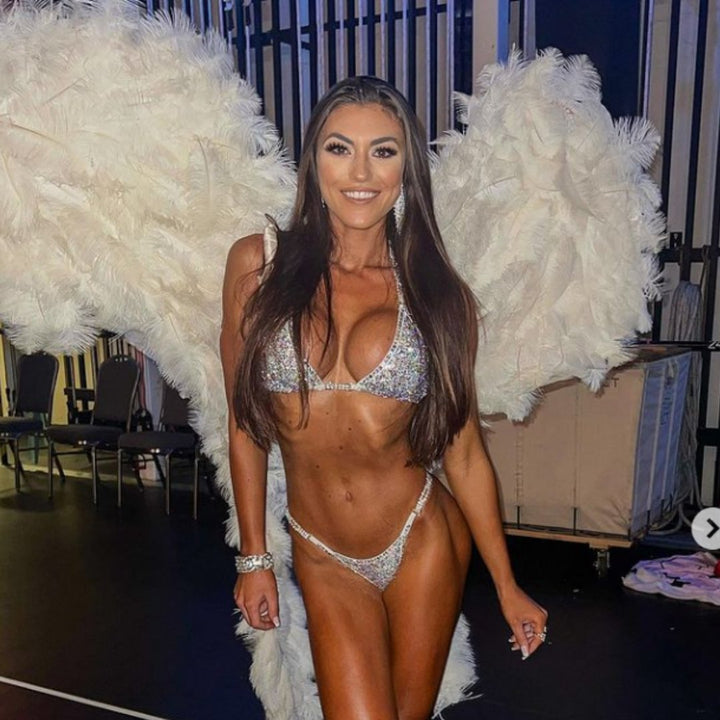 Introducing White Goddess Radiance: a Matte White competition suit adorned with Crystal Clear and Crystal AB crystals, creating an angelic and elegant look perfect for the stage! ✨👼 Stand out with grace and confidence in this stunning ensemble. #BodybuildingSuit #CompetitionReady #WhiteGoddessRadiance