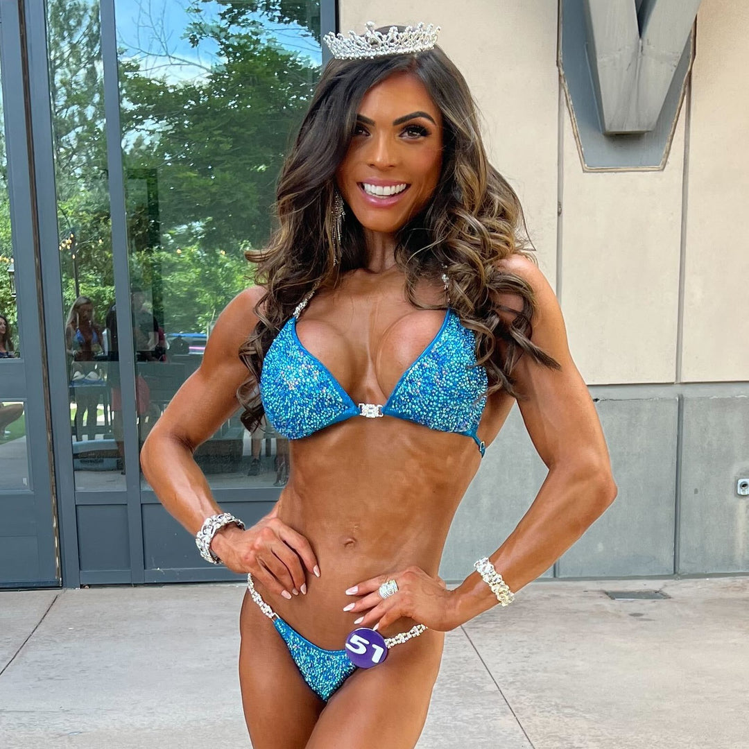 "Introducing Isa's Aquamarine Dream Radiance: The ultimate suit to illuminate your stage presence. Designed to bring out confidence in all female bodybuilders, this ensemble shines with regal elegance, empowering you to own the spotlight with grace and power. 💎✨ #FemaleBodybuilding #StageConfidence"